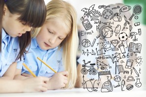 Two diligent schoolgirls doing classwork together