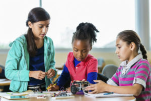 Little-girls-building-robots-during-science-class-after-school introvert optimized