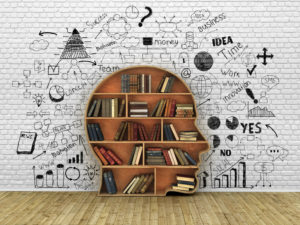 Wood Bookshelf in the Shape of Human Head and books near break wall, Knowledge Concept