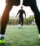 Balancing athletics and education: Q&A with footballer Mark Swainston Young soccer players training in football field. Football team practicing on soccer pitch outdoors.