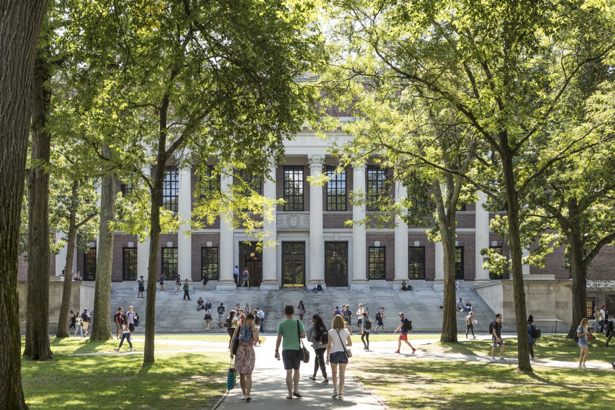 Cambridge, Ma: Students and tourists rest in lawn chairs in Harvard Yard, the open old heart of Harvard University campus  in Cambridge, MA, USA.