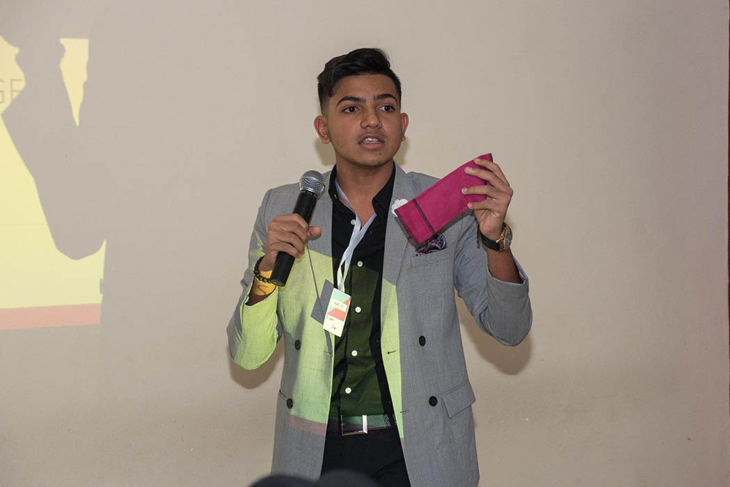 Ziyaan Virji presenting his sanitary pads that are washable (therefore re-usable).