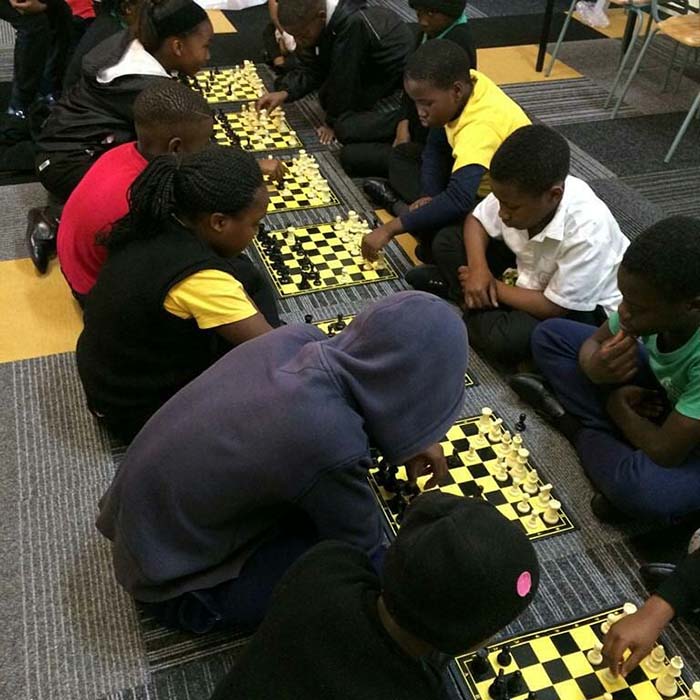 Students competing in a chess competition.